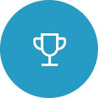 A simple blue circular icon featuring a white trophy symbol, representing achievement and success.